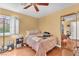 Bedroom with hardwood floors, shuttered window and sliding mirror closet doors at 8629 Estrelita Dr, Las Vegas, NV 89128