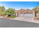 Beautiful one-story home featuring a two-car garage and mature landscaping at 8629 Estrelita Dr, Las Vegas, NV 89128