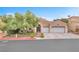 Charming single-story home with well-maintained landscaping and a two-car garage at 8629 Estrelita Dr, Las Vegas, NV 89128