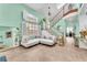 Bright foyer featuring staircase with white wood trim and views of the living area at 8629 Estrelita Dr, Las Vegas, NV 89128