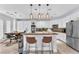 Spacious kitchen with white cabinetry, stainless steel appliances, and a large island at 8629 Estrelita Dr, Las Vegas, NV 89128