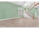 Bright living room featuring tile flooring and an elegant staircase at 8629 Estrelita Dr, Las Vegas, NV 89128