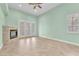 Bright living room featuring tile flooring, fireplace, and glass doors at 8629 Estrelita Dr, Las Vegas, NV 89128