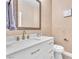 Stylish powder room boasts a white vanity, elegant mirror, and modern gold fixtures at 8629 Estrelita Dr, Las Vegas, NV 89128