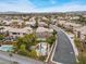 Aerial shot of a home with a private backyard featuring a custom pool and tiki hut at 8970 Lansberry Ct, Las Vegas, NV 89147