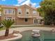 Backyard featuring a swimming pool, patio, and desert landscape at 8970 Lansberry Ct, Las Vegas, NV 89147