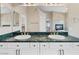 Bathroom with double sinks, granite countertop and white cabinetry at 8970 Lansberry Ct, Las Vegas, NV 89147