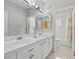 Bathroom featuring double sinks with vanity, a soaking tub and shower, and tile flooring at 8970 Lansberry Ct, Las Vegas, NV 89147