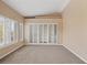 Bright bedroom with shuttered windows and neutral carpet at 8970 Lansberry Ct, Las Vegas, NV 89147