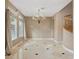 Dining room with chandelier, tile floors, and large windows at 8970 Lansberry Ct, Las Vegas, NV 89147