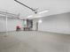 Spacious garage with epoxy flooring and ample room for vehicles and storage at 8970 Lansberry Ct, Las Vegas, NV 89147