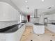 Spacious kitchen featuring white cabinetry, black countertops, and stainless steel appliances at 8970 Lansberry Ct, Las Vegas, NV 89147