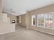 Bright living area with plantation shutters, fireplace and a large window at 8970 Lansberry Ct, Las Vegas, NV 89147