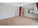 Open plan living room with wood floors and view of the kitchen at 8970 Lansberry Ct, Las Vegas, NV 89147