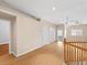 Bright living room features hardwood floors, neutral walls, and staircase detail at 8970 Lansberry Ct, Las Vegas, NV 89147