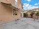 Back patio with a concrete slab, outdoor grill area, and a retractable awning at 8970 Lansberry Ct, Las Vegas, NV 89147