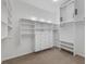 A large walk-in closet with multiple shelves and drawers at 8970 Lansberry Ct, Las Vegas, NV 89147