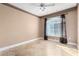 Bedroom featuring marble floors, neutral walls, ceiling fan and large window at 9000 Las Vegas Blvd # 2243, Las Vegas, NV 89123