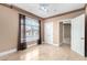 Bedroom featuring marble floors, neutral walls, ceiling fan and large window at 9000 Las Vegas Blvd # 2243, Las Vegas, NV 89123