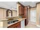 Open concept kitchen with breakfast bar, wooden cabinets, and sink at 9000 Las Vegas Blvd # 2243, Las Vegas, NV 89123