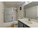 Standard bathroom featuring a shower-tub combo, tile floors, a toilet, and a vanity at 905 Rockview Dr # 101, Las Vegas, NV 89128