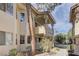 A tan two-story condo shows clean lines and a private balcony with decorative pillar supports at 905 Rockview Dr # 101, Las Vegas, NV 89128