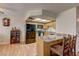 A view of the kitchen and dining bar area shows hardwood floors and modern appliances at 905 Rockview Dr # 101, Las Vegas, NV 89128