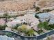 Aerial view of an estate home, lush landscaping, and a private pool at 9325 Verlaine Ct, Las Vegas, NV 89145