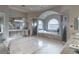 Bright, spacious bathroom with dual sinks, large soaking tub, walk-in shower, and decorative tile flooring at 9325 Verlaine Ct, Las Vegas, NV 89145