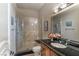 Modern bathroom featuring a glass enclosed shower, granite countertops, and tile flooring at 9325 Verlaine Ct, Las Vegas, NV 89145