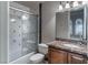 Charming bathroom with marble countertop and shower-over-tub with decorative tile at 9325 Verlaine Ct, Las Vegas, NV 89145