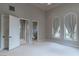 Bright and airy bedroom with arch windows leading to a en suite bathroom at 9325 Verlaine Ct, Las Vegas, NV 89145