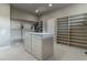 Large walk-in closet featuring custom storage solutions, center island, and ample shelving space at 9325 Verlaine Ct, Las Vegas, NV 89145