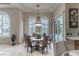 Bright dining area with shuttered windows, elegant chandelier and easy access to outdoor spaces at 9325 Verlaine Ct, Las Vegas, NV 89145