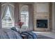 Main bedroom featuring a fireplace and large windows at 9325 Verlaine Ct, Las Vegas, NV 89145