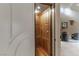 A residential elevator featuring wooden panels and an internal control panel, offering accessibility within the home at 9325 Verlaine Ct, Las Vegas, NV 89145