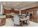 Gourmet kitchen featuring a center island, granite countertops, and stainless steel appliances at 9325 Verlaine Ct, Las Vegas, NV 89145