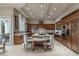 Spacious kitchen featuring custom cabinets, granite countertops, and stainless steel appliances at 9325 Verlaine Ct, Las Vegas, NV 89145