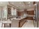 Spacious kitchen with a large island, stainless steel appliances, and custom cabinetry at 9325 Verlaine Ct, Las Vegas, NV 89145