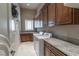 Functional laundry room with ample counter space, modern washer and dryer, and built-in cabinets at 9325 Verlaine Ct, Las Vegas, NV 89145