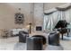 Elegant living room showcasing high ceilings, natural light, fireplace and a stylish grand piano at 9325 Verlaine Ct, Las Vegas, NV 89145