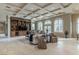 Spacious living room featuring a coffered ceiling, built-in shelving, and archways at 9325 Verlaine Ct, Las Vegas, NV 89145