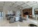 Open concept living room boasts a coffered ceiling, built-in shelving, and travertine floors at 9325 Verlaine Ct, Las Vegas, NV 89145