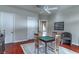 Cozy living room featuring a game table, chairs, and wood floors at 9325 Verlaine Ct, Las Vegas, NV 89145