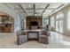 Bright and airy living room with coffered ceilings, built-in shelving, and large windows at 9325 Verlaine Ct, Las Vegas, NV 89145