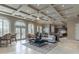 Inviting living space with coffered ceilings, arched windows, and access to outdoor pool at 9325 Verlaine Ct, Las Vegas, NV 89145