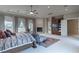 Large main bedroom featuring a fireplace, sitting area, and large windows at 9325 Verlaine Ct, Las Vegas, NV 89145