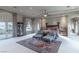 Well-lit main bedroom with a large rug, elegant furniture, and balcony access at 9325 Verlaine Ct, Las Vegas, NV 89145