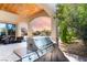 Outdoor kitchen with large stainless steel grill, granite countertops and views of pool and yard at 9325 Verlaine Ct, Las Vegas, NV 89145