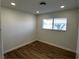 Bedroom with wood-look floors and neutral paint, illuminated by recessed lighting at , Las Vegas, NV 89121